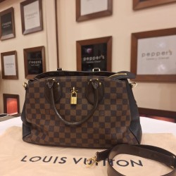Louis Vuitton Normandy bag in Damier Ebene canvas features structured leather sides and signature gold-toned hardware
