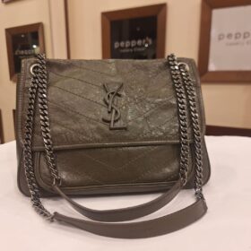 Saint Laurent Niki Medium shoulder bag in a textured vintage-style leather with chevron quilting and a matching YSL logo plaque